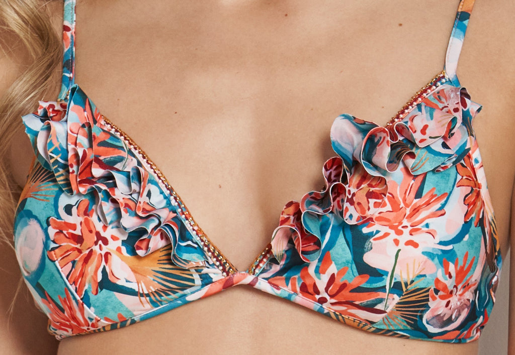 A close up look on the front of the Shine Triangle Bikini Bra, showing the beaded and ruffled lining in front and neck and back adjustable ties.